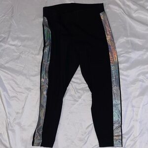 Torrid size 1X black leggings with iridescent dotted stripes on legs